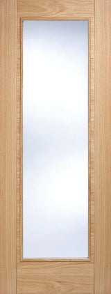 Oak glazed internal door with vertical glass panel and light wood grain finish