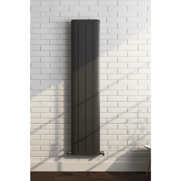 Black radiator on a white brick wall