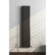 Black radiator on a white brick wall