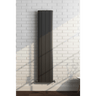 Black radiator on a white brick wall