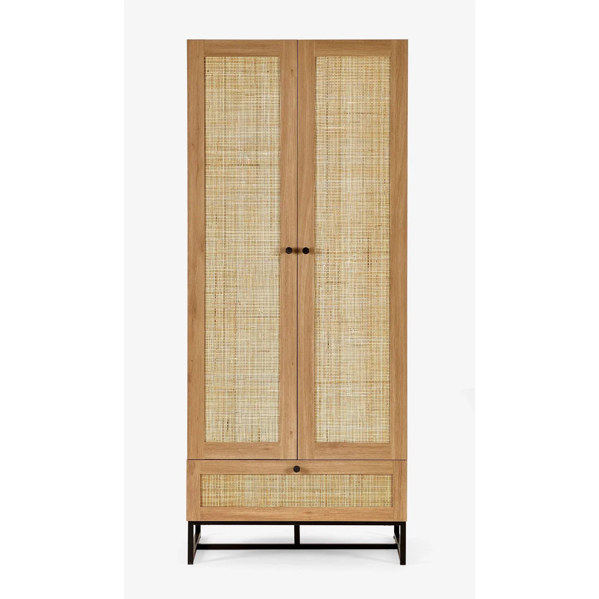 Oak wardrobe with rattan panel doors and lower drawer on black metal legs, front view