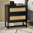 Black two-drawer bedside table with rattan fronts beside bed in modern bedroom setting