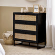 Black wooden 3 drawer chest with rattan fronts in modern bedroom setting
