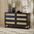 Black 6 drawer chest with rattan fronts, styled with vases, books and decor in modern room