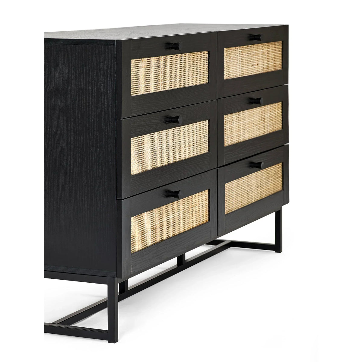 Black 6 drawer chest with rattan drawer fronts and metal legs, side angle view