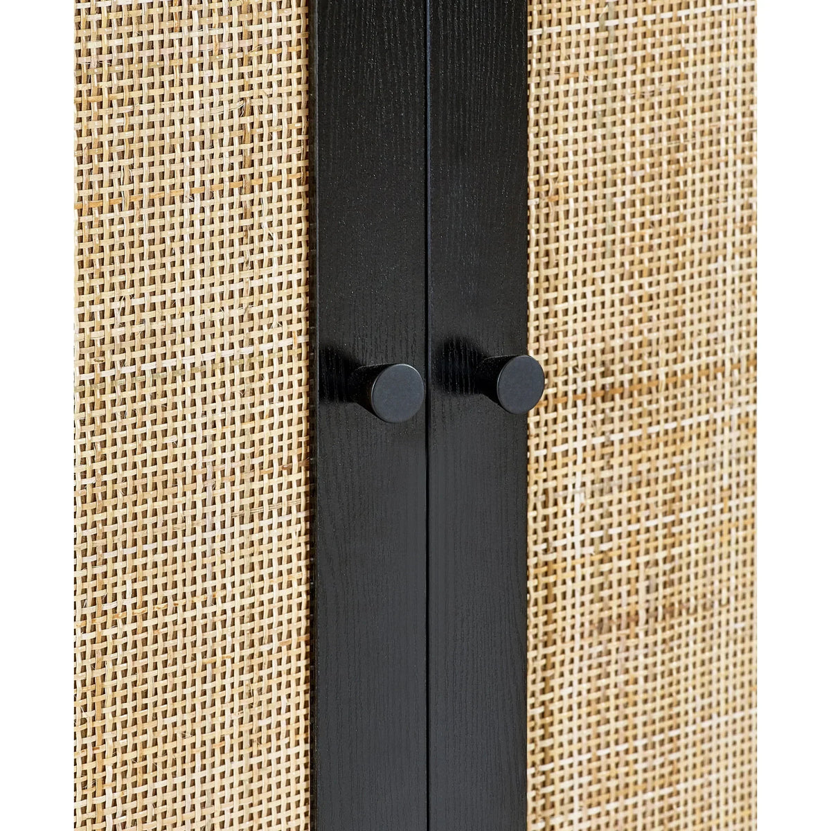 Black wardrobe with rattan doors closeup showing wood handles and woven panel detail