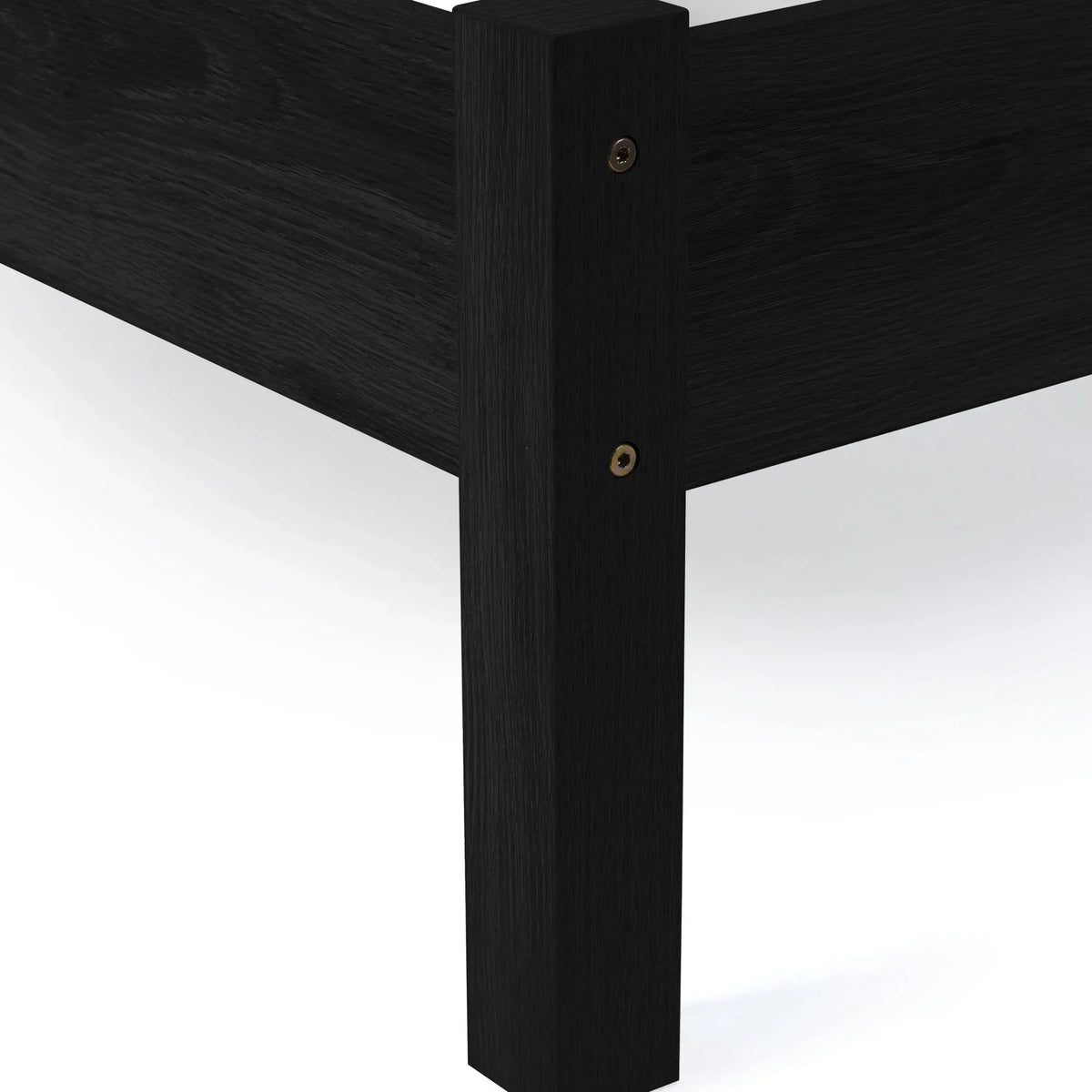 Black rattan double bed corner with visible wood grain and sturdy leg detail