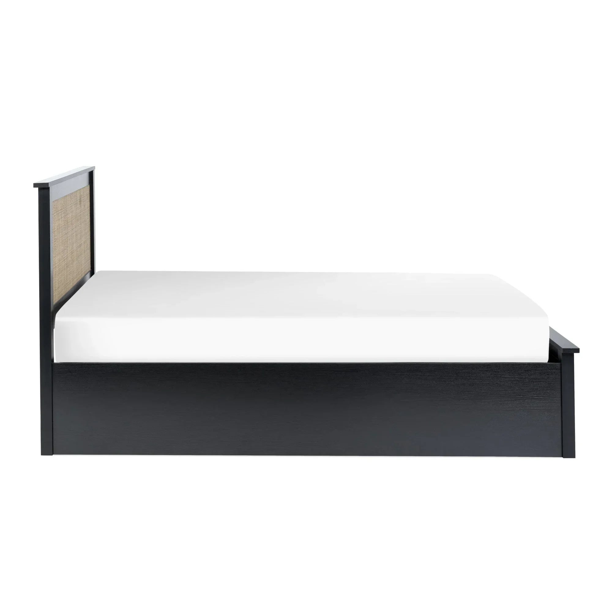 Black rattan ottoman bed with double size frame and cane panel headboard, side view