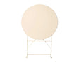 Champagne round metal folding table shown upright on white background