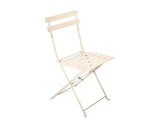 Champagne metal folding chair with slatted seat and backrest, side view