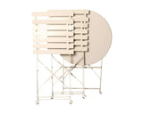 Champagne metal folding garden tables stacked upright on white background