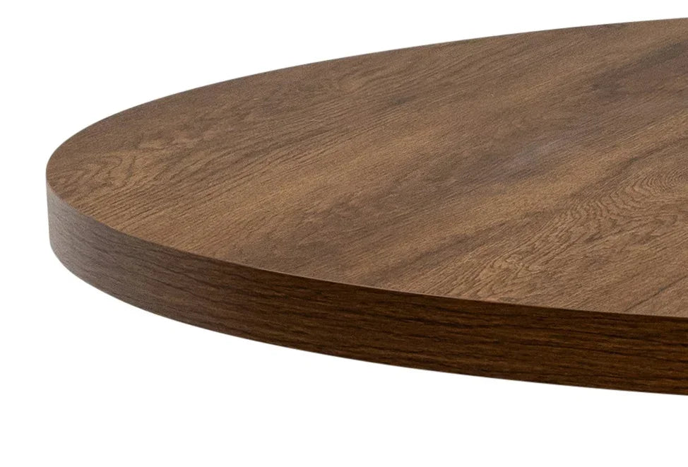 Close up of round wooden dining table top with smooth finish and visible wood grain