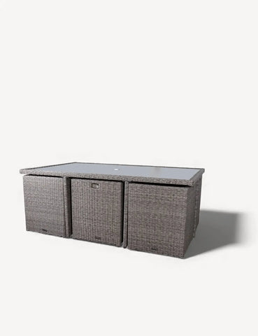 Grey rattan garden dining table with glass top and storage compartments