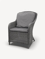 Grey rattan armchair with dark seat and back cushions, front angle view