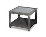 Grey rattan outdoor coffee table with glass top and storage shelf