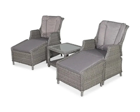 Grey rattan garden lounge set with two reclining chairs, footrests, and glass-top side table
