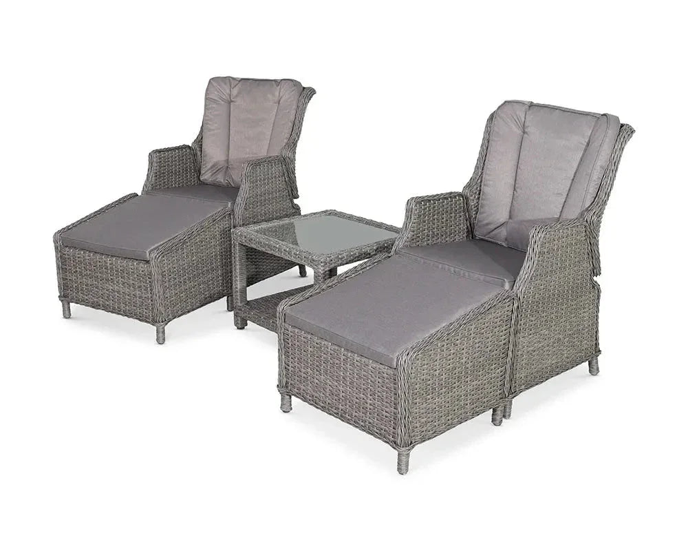Grey rattan garden lounge set with two reclining chairs, footrests, and glass-top side table