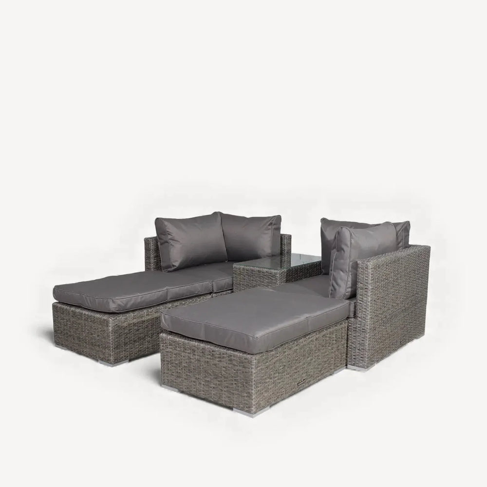 Grey rattan garden sofa set with two loungers and padded seat cushions