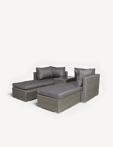 Grey rattan garden sofa set with two loungers and padded seat cushions