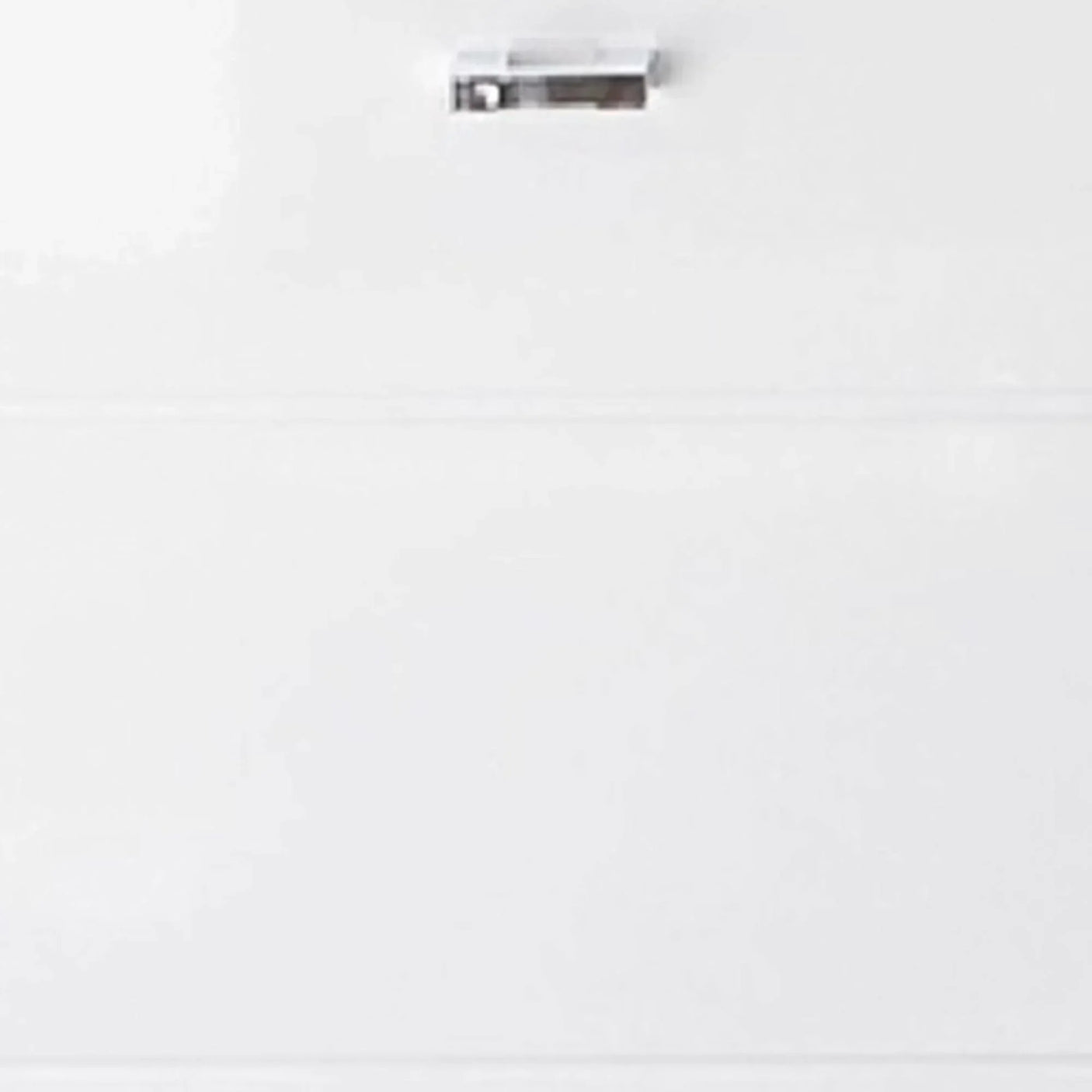 Gloss white drawer front with silver handle, modern furniture finish detail view