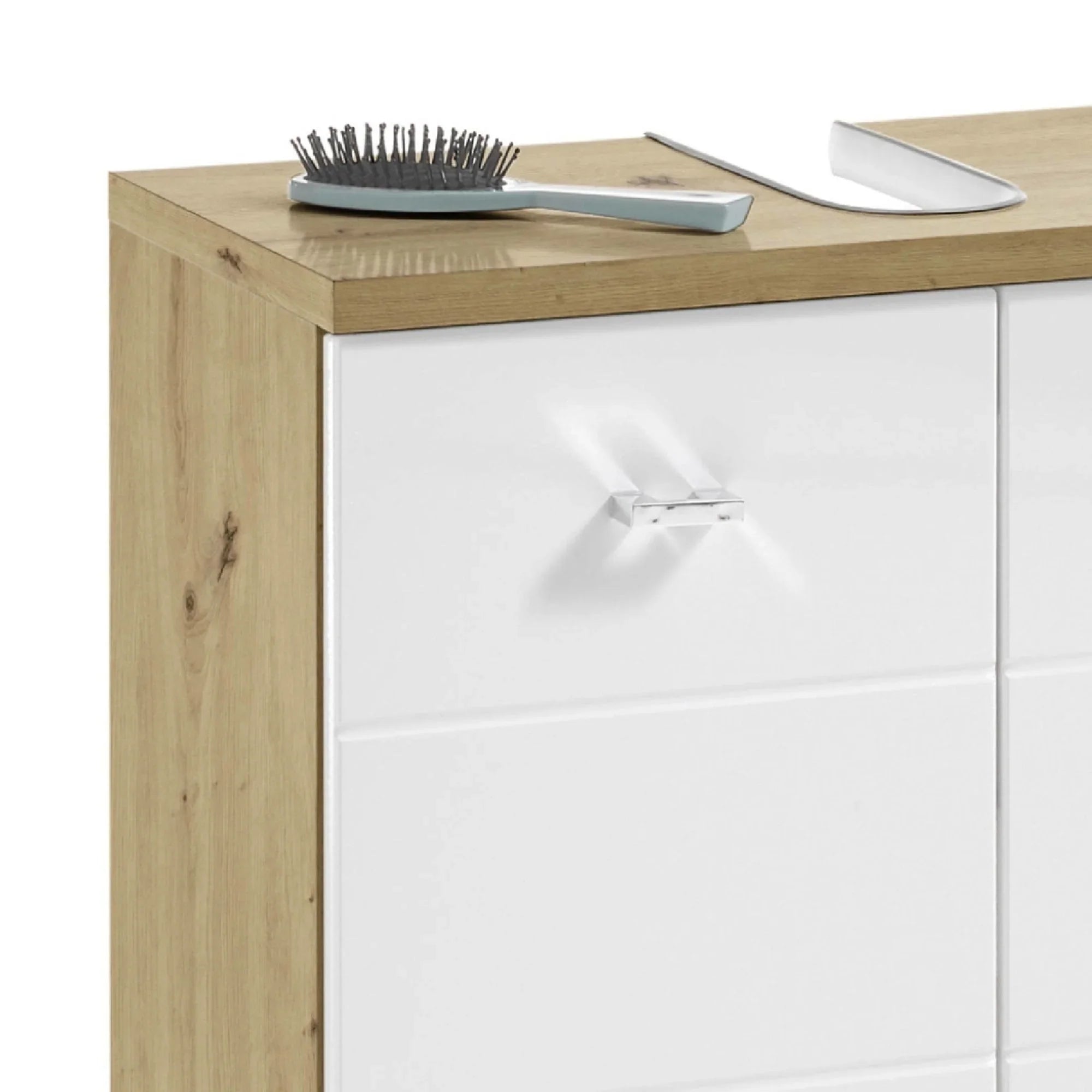 Oak and white cabinet with chrome handle, hairbrush and shoehorn on wooden top