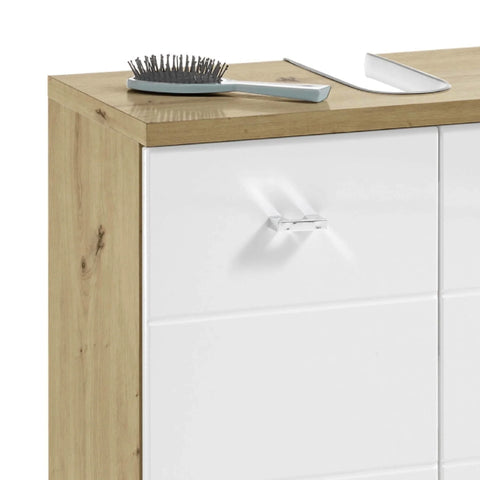 Oak and white cabinet with chrome handle, hairbrush and shoehorn on wooden top