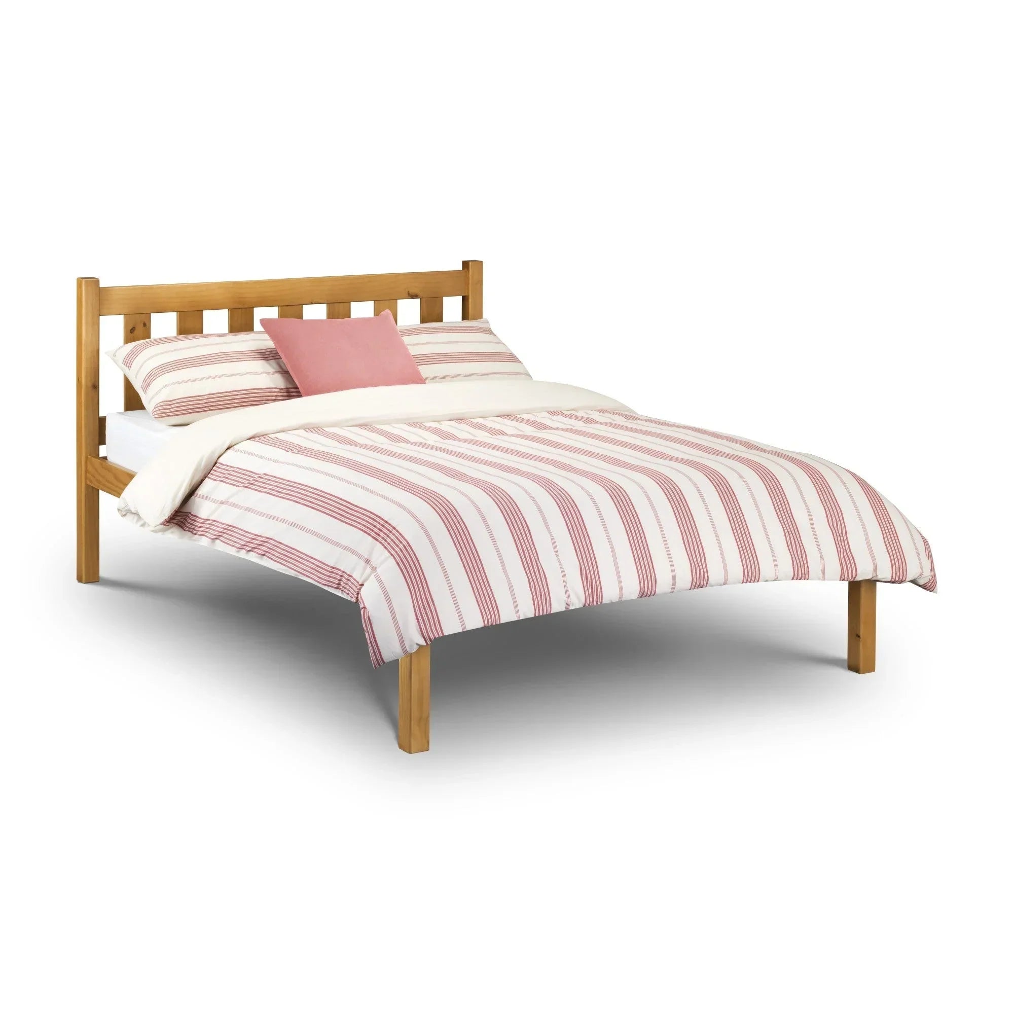 Pine double bed frame with slatted headboard and striped bedding, angled front view