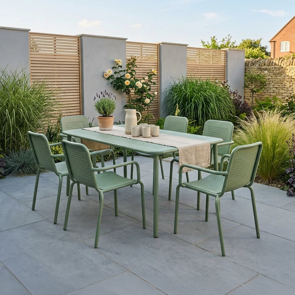 Olive green outdoor dining set with six chairs and rectangular table on patio
