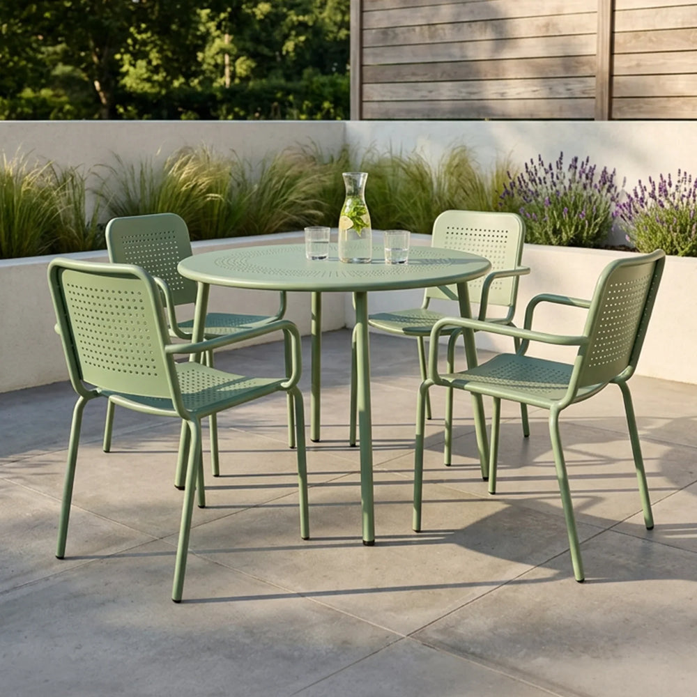 Olive green metal outdoor dining set with round table and four chairs on patio