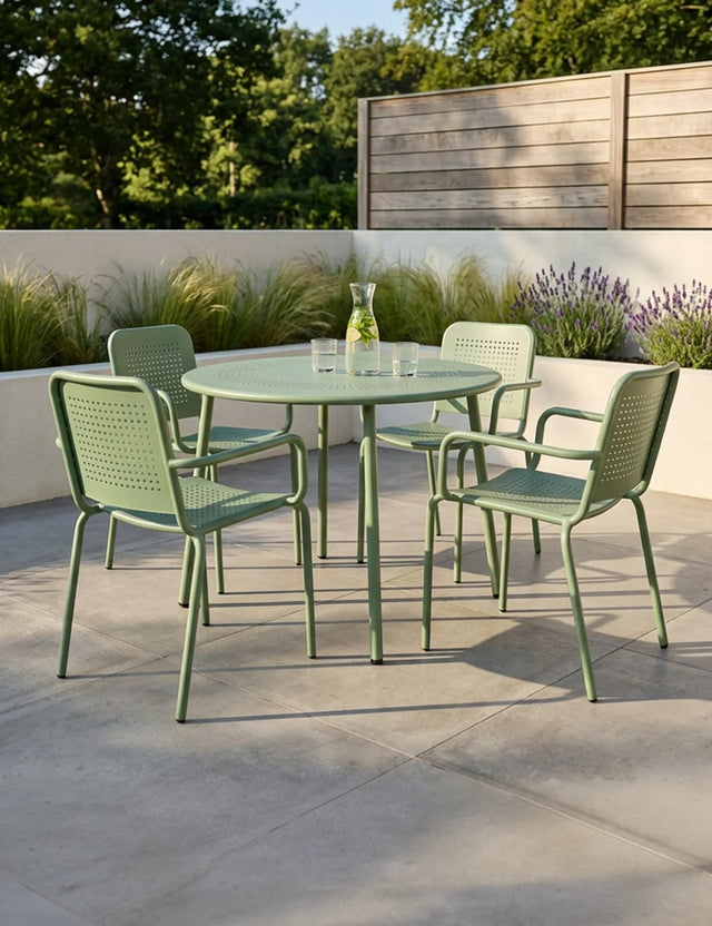 Olive green metal outdoor dining set with round table and four chairs on patio