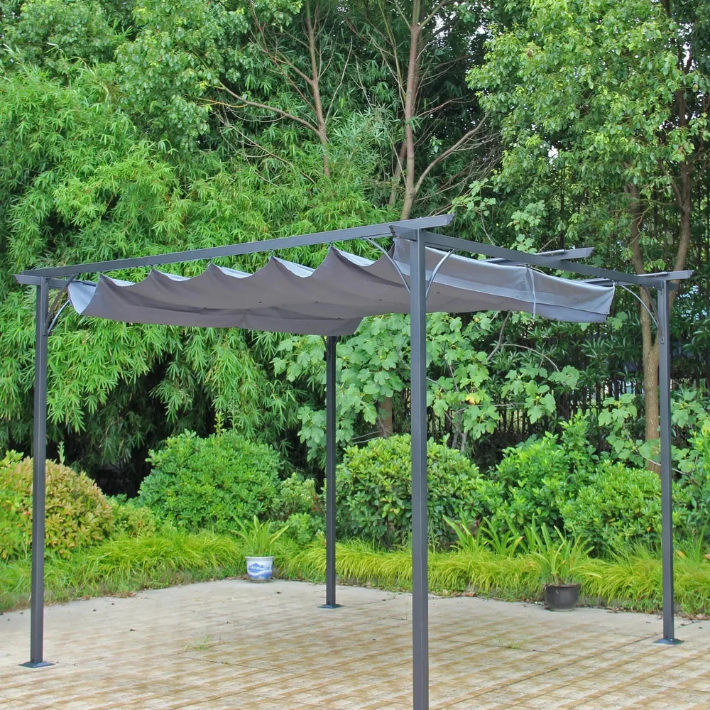 Grey metal garden pergola with retractable canopy on paved patio, surrounded by greenery