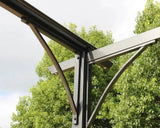 Grey pergola corner frame detail against green trees outdoors