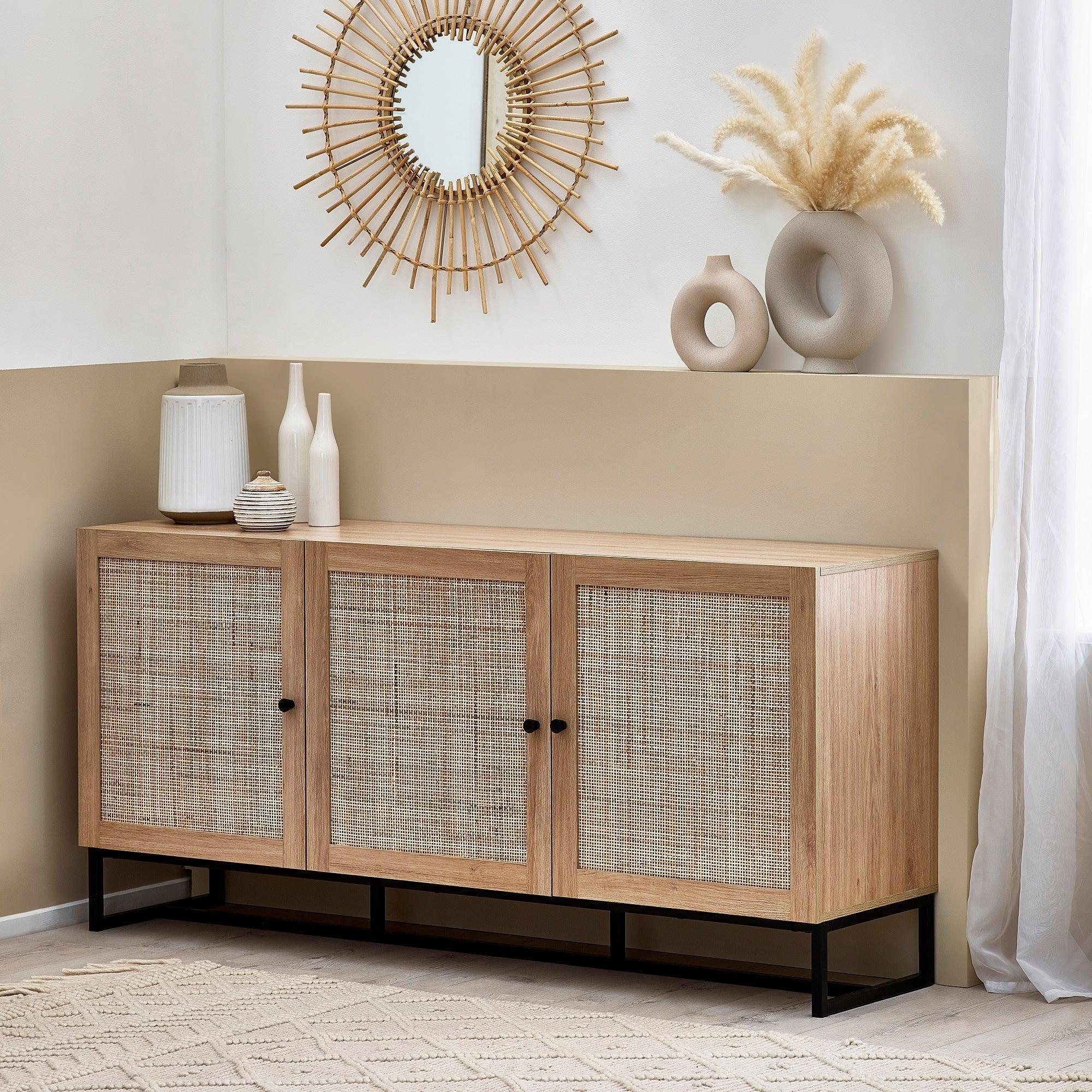 Oak sideboard with rattan doors and metal legs in a modern living room setting