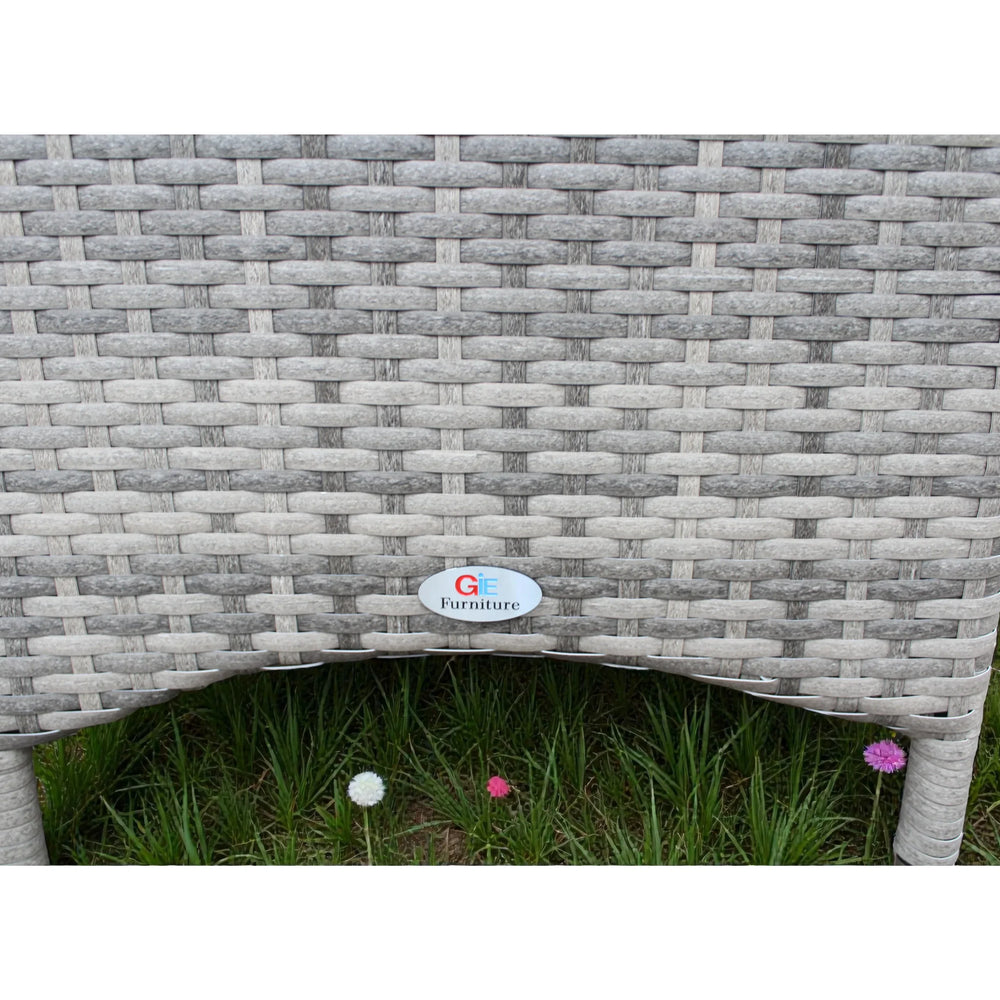 Close view of grey rattan garden bistro set table leg and weave texture outdoors