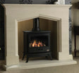 Elegant Coniston 54" Portuguese Limestone Suite featuring a classic design with a beautifully crafted limestone mantel and a black stove with a glowing fire.