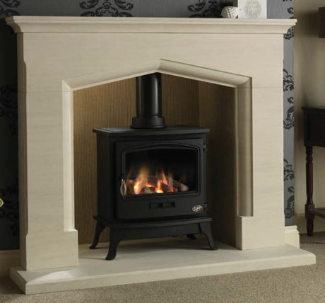 Elegant Coniston 54" Portuguese Limestone Suite featuring a classic design with a beautifully crafted limestone mantel and a black stove with a glowing fire.