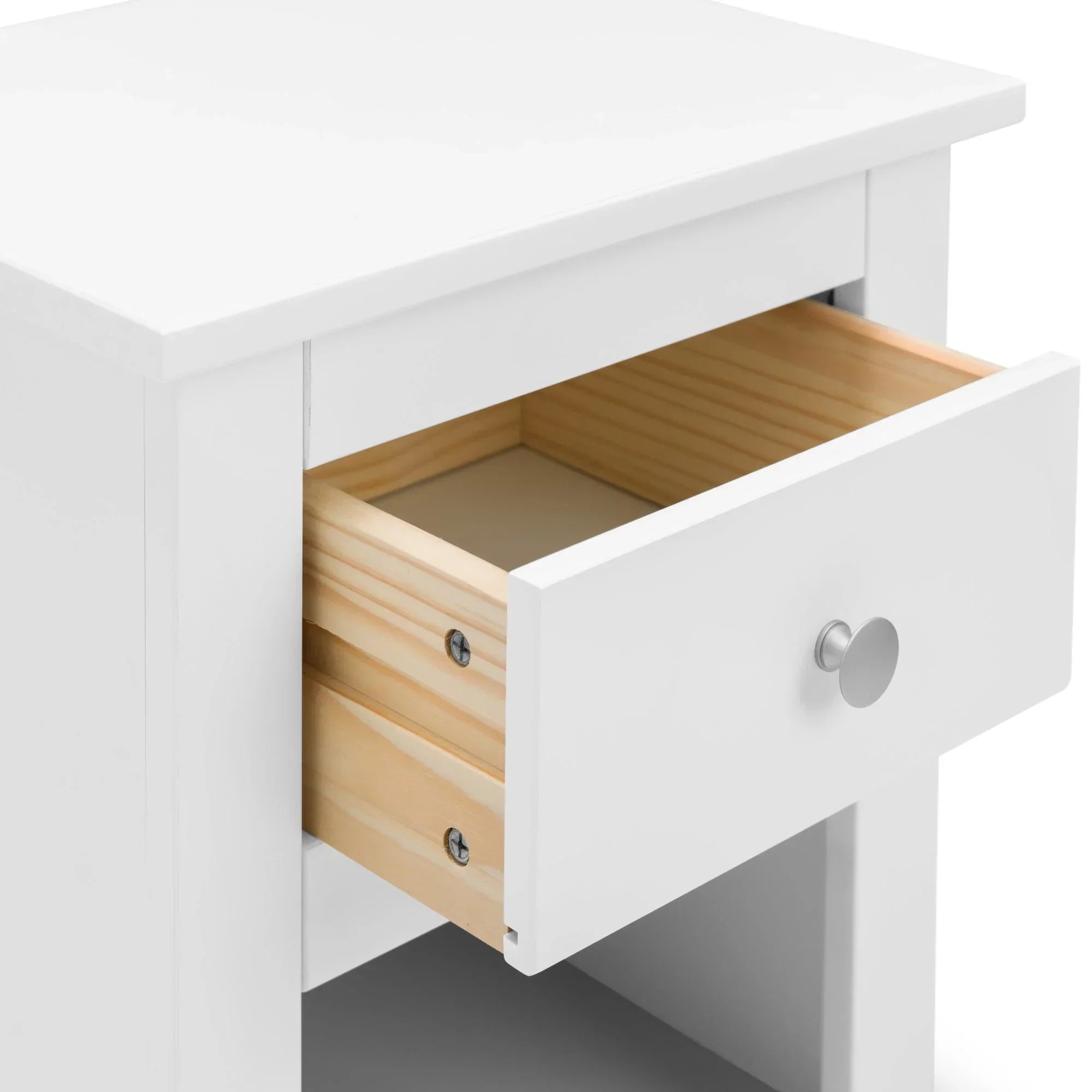 White bedside table with open wooden drawer and round silver handle
