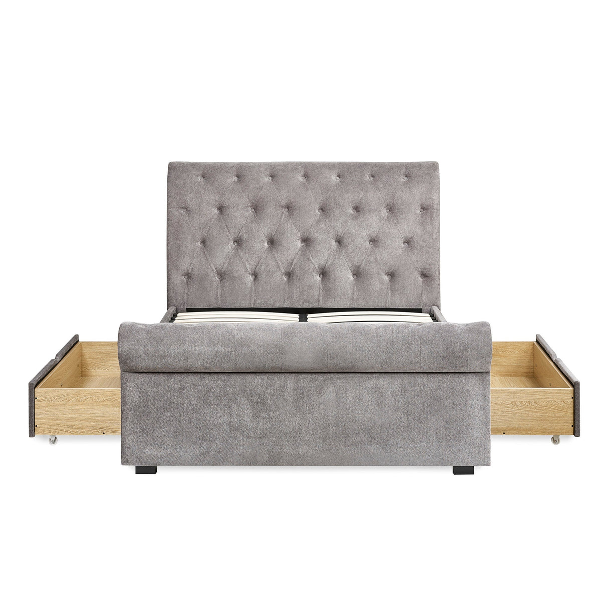 Frontal view of grey fabric double bed with fully opened side drawers revealing wooden storage inside.