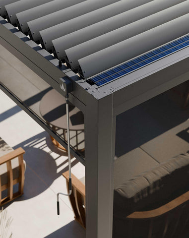Aluminium pergola with adjustable louvre roof, manual handle, and mesh side screen