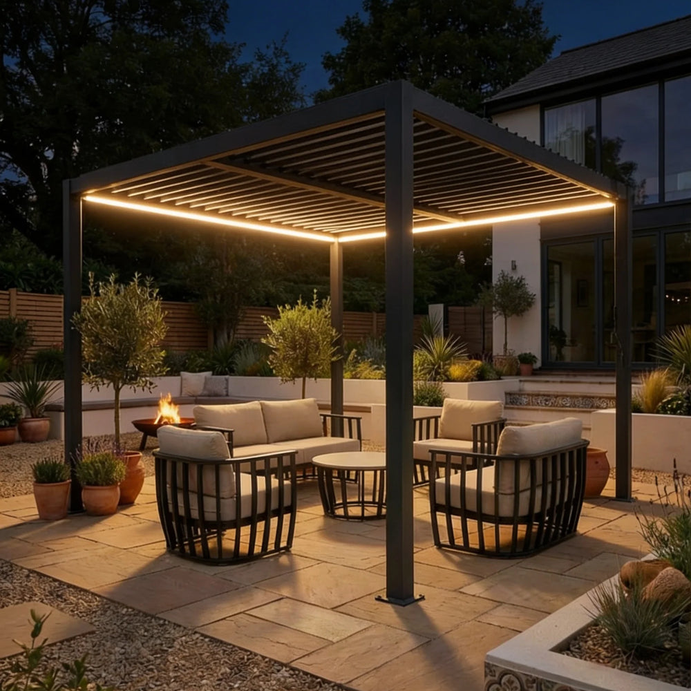 Outdoor patio area with pergola, seating, and garden lights at night.