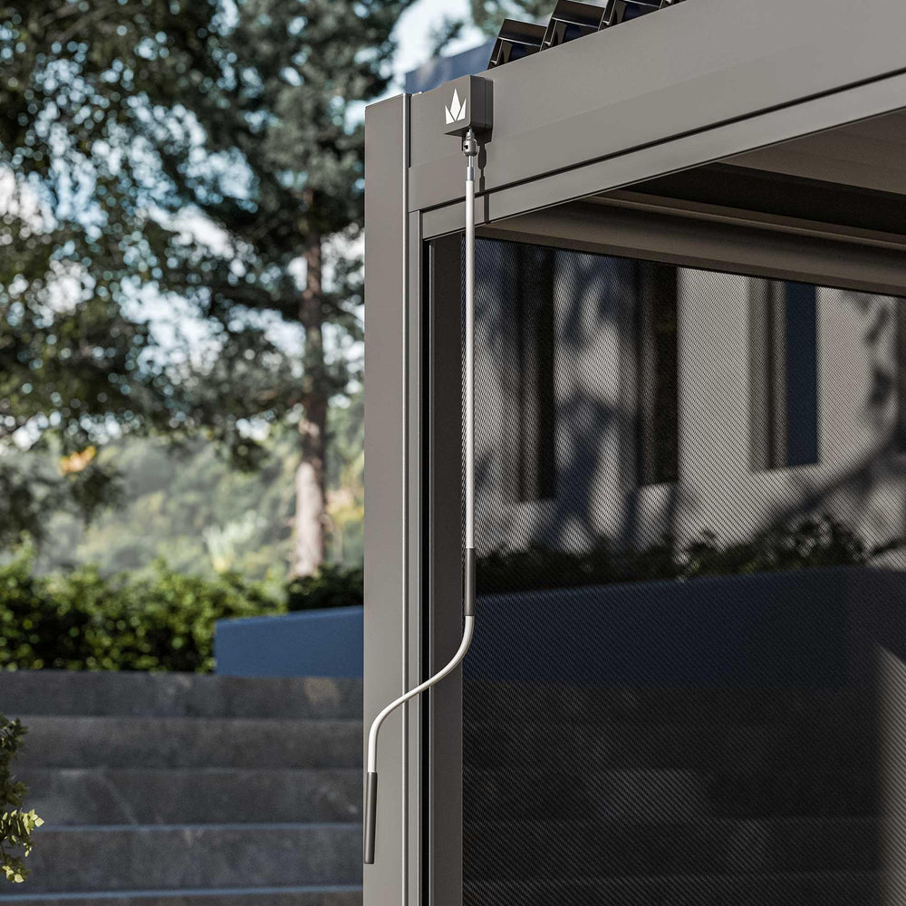 Grey metal pergola with winding handle and mesh side panel, modern garden background