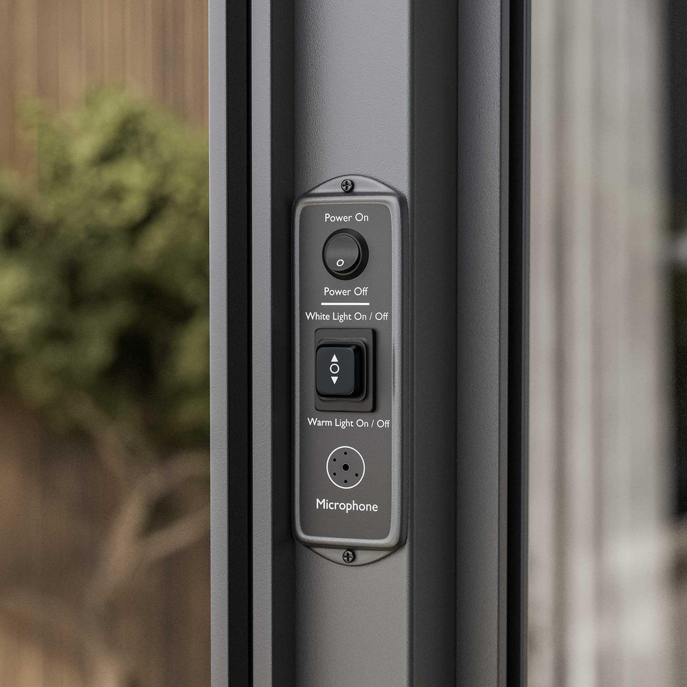 Close-up of smart patio door control panel with buttons for power, lighting, and microphone