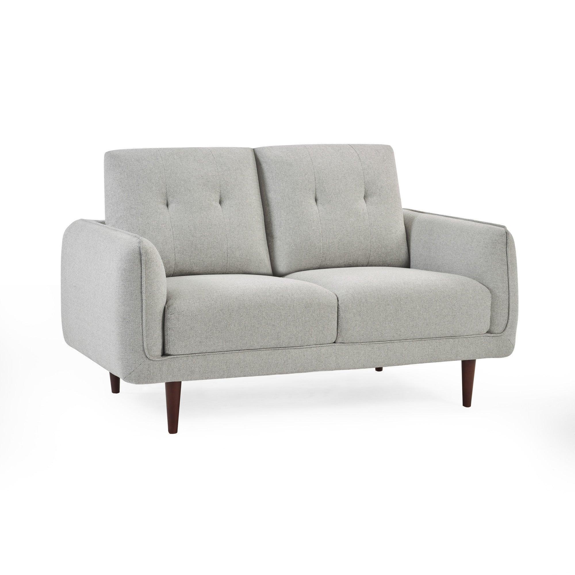 Light grey fabric sofa with wooden legs and button-tufted backrest, front view