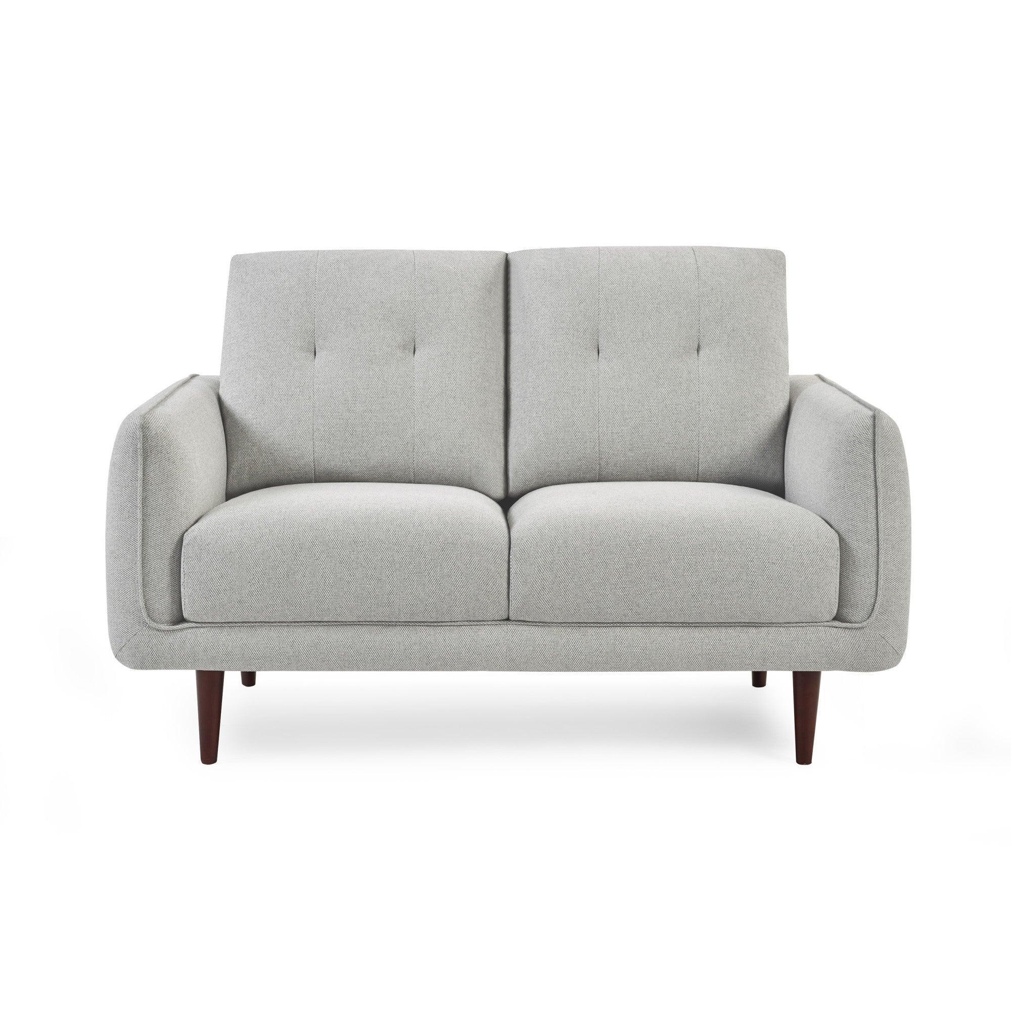 Light grey fabric sofa with button-tufted backrest and wooden legs, front view