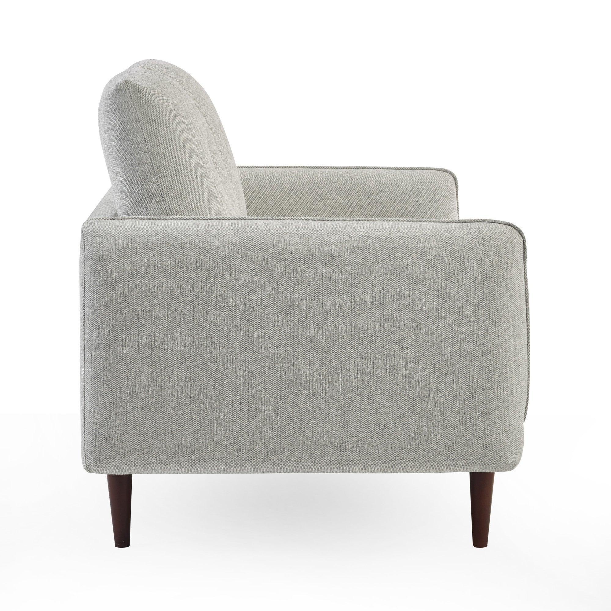 Light grey fabric sofa side view with tapered wooden legs