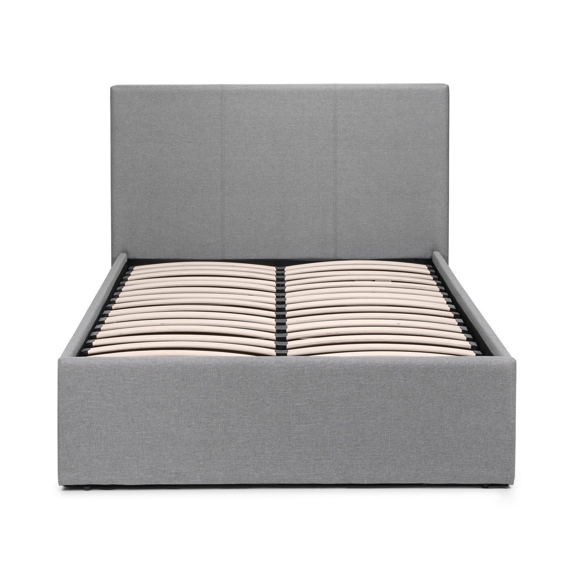 Grey lift-up storage bed with padded headboard and wooden slatted base, front view