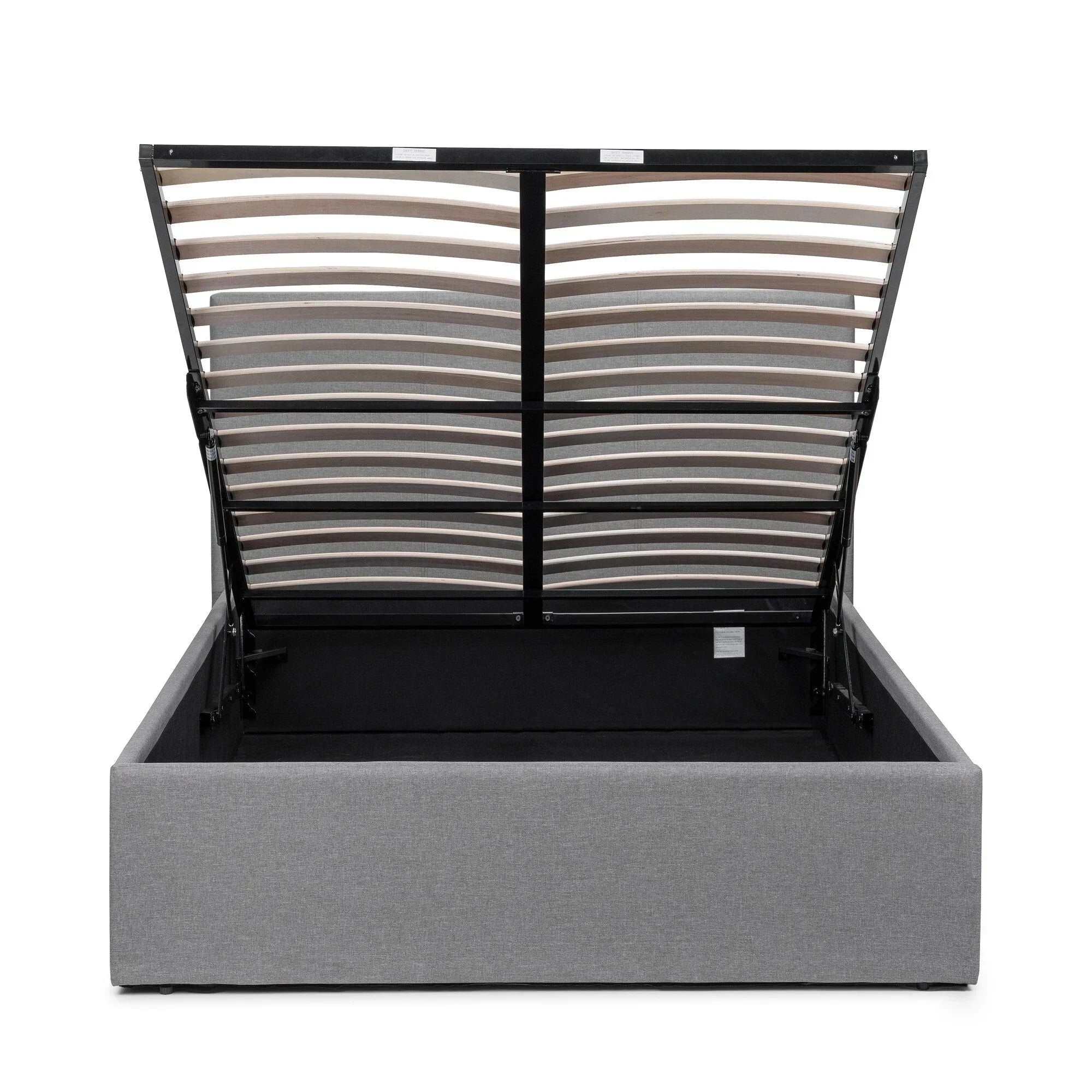 Grey lift-up storage bed with open slatted base showing under-bed storage compartment