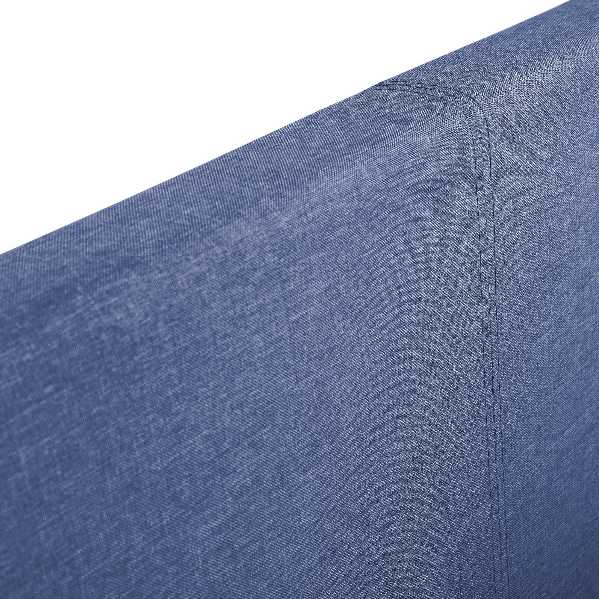 Blue fabric headboard detail of lift-up storage bed with visible stitched seams
