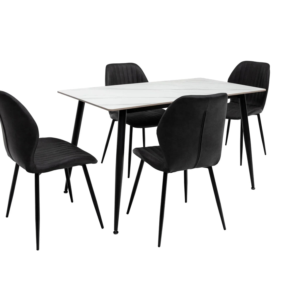 Modern dining set with four black velvet chairs and a rectangular white table