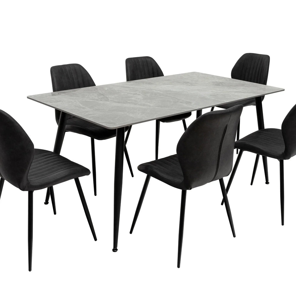 Rectangular grey dining table with six black upholstered chairs, modern metal legs